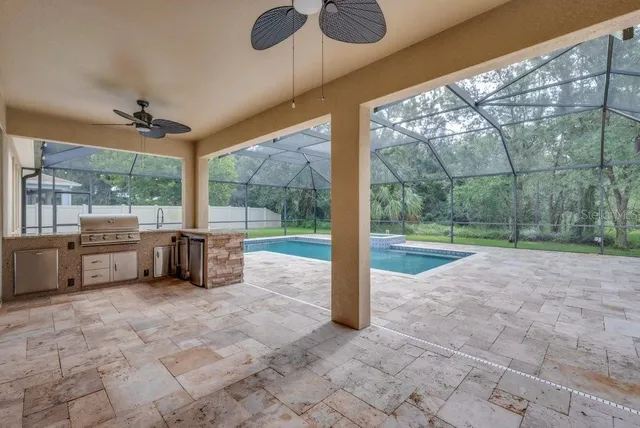 a view of a patio with a backyard