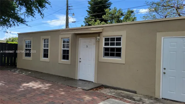a view of a house with a tree