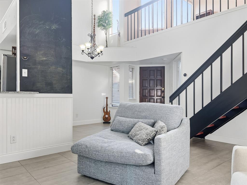 539 Ranch Trail, Unit 172 Irving, TX 75063 - Photo 11 of 40 a living room with furniture and stairs