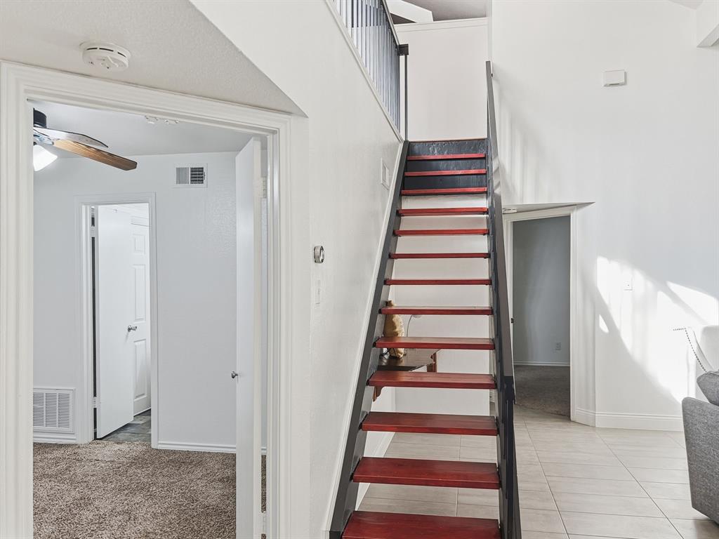 539 Ranch Trail, Unit 172 Irving, TX 75063 - Photo 18 of 40 a view of entryway and hall with wooden floor