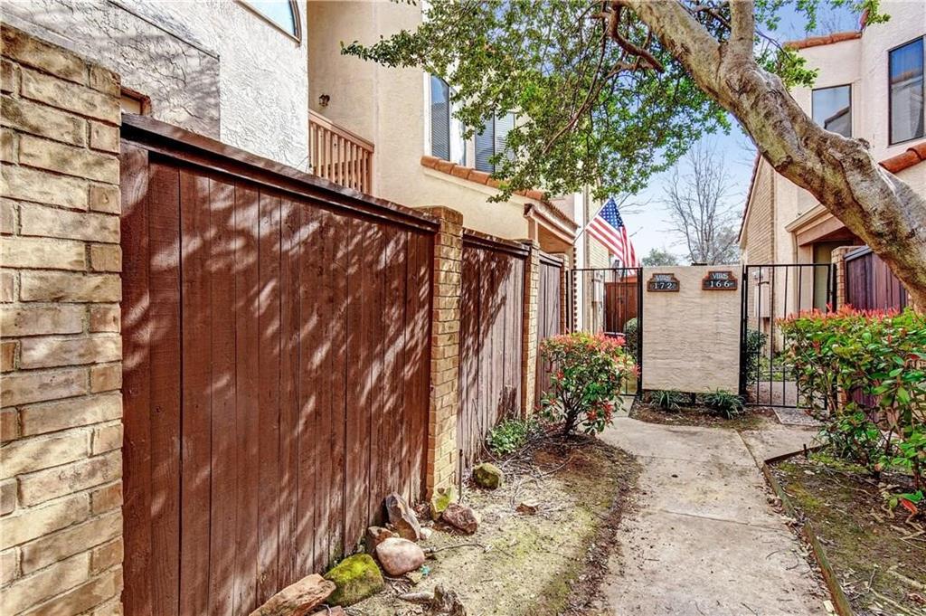 539 Ranch Trail, Unit 172 Irving, TX 75063 - Photo 2 of 40 a view of a house with a yard