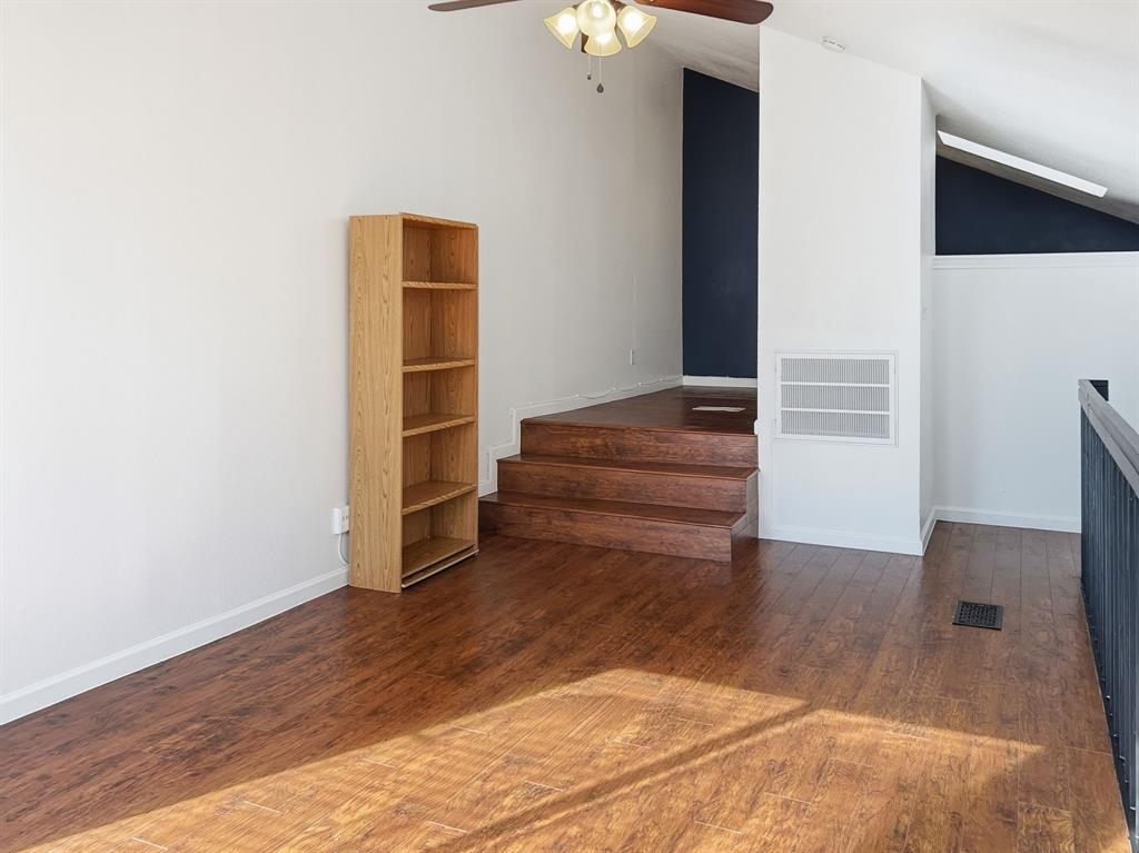 539 Ranch Trail, Unit 172 Irving, TX 75063 - Photo 22 of 40 a view of a hallway with wooden floor and entryway