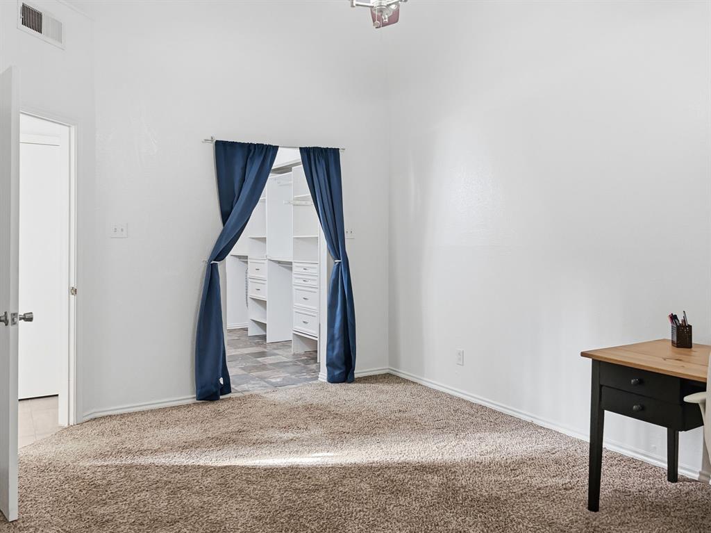 539 Ranch Trail, Unit 172 Irving, TX 75063 - Photo 26 of 40 a view of a livingroom with wooden floor and furniture