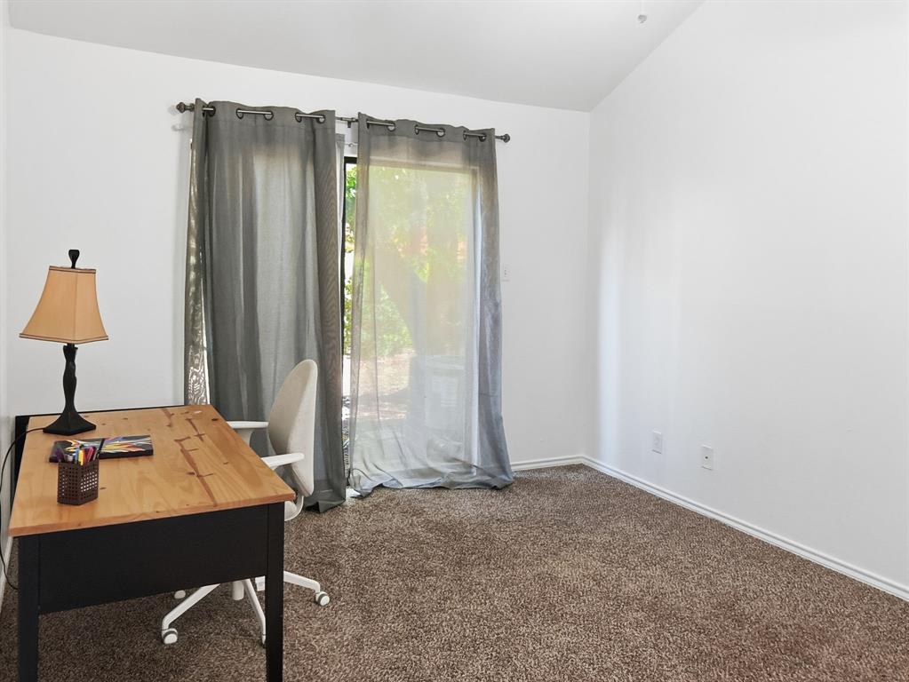 539 Ranch Trail, Unit 172 Irving, TX 75063 - Photo 30 of 40 a view of room with a table and workspace