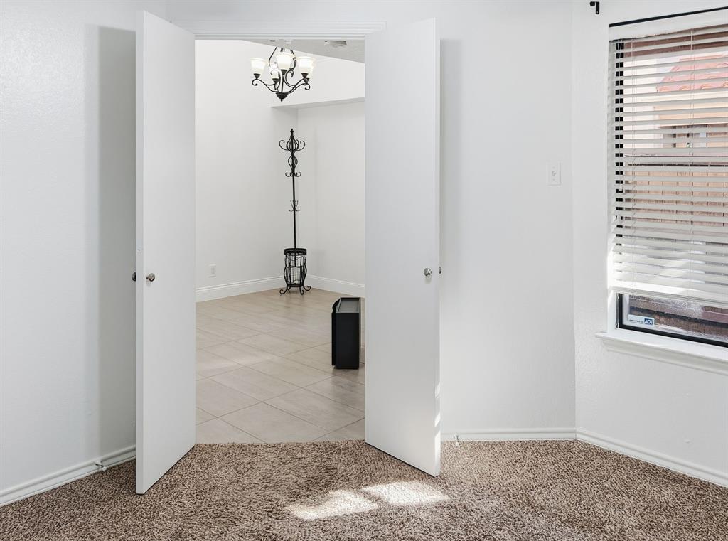 539 Ranch Trail, Unit 172 Irving, TX 75063 - Photo 34 of 40 a view of a hallway with a white cabinet