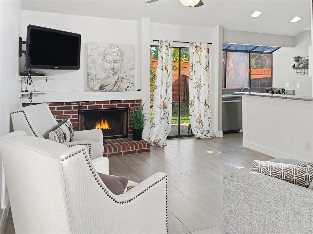 539 Ranch Trail, Unit 172 Irving, TX 75063 - Photo 6 of 40 a living room with furniture and a flat screen tv