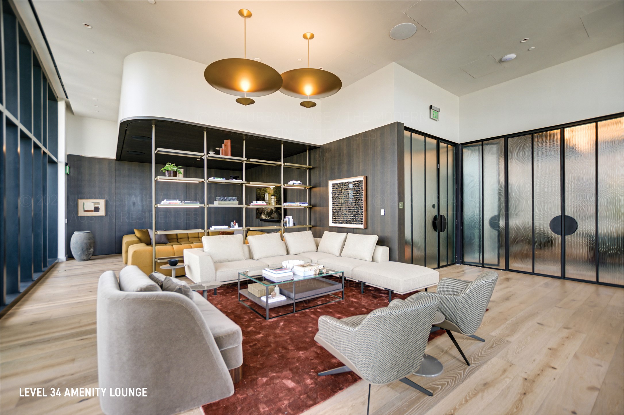 610 Davis Street, Unit 4007 Austin, TX 78701 - Photo 28 of 29 Living room featuring wood finished floors and a towering ceiling