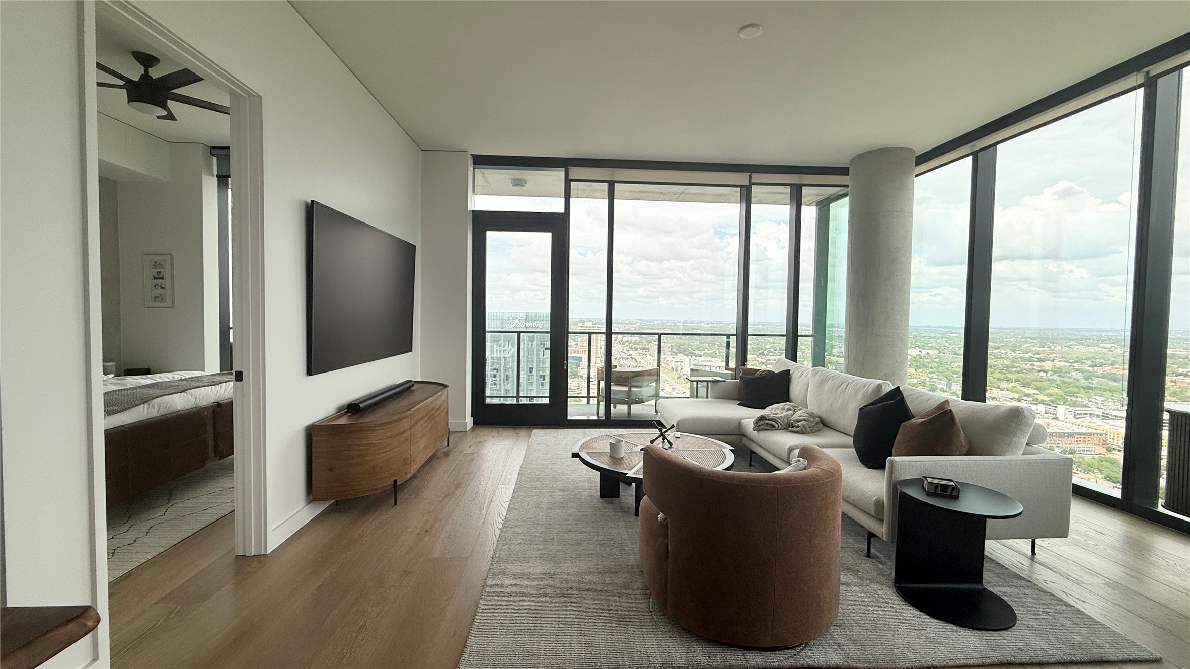 610 Davis Street, Unit 4007 Austin, TX 78701 - Photo 3 of 29 The property features hardwood floors, floor-to-ceiling windows, and a balcony