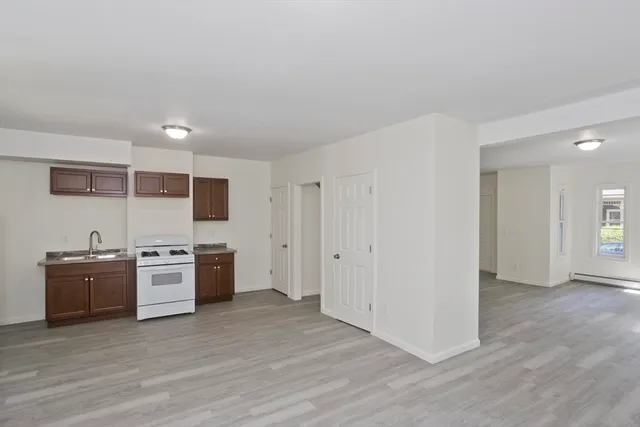 a kitchen with stainless steel appliances granite countertop a stove and a refrigerator