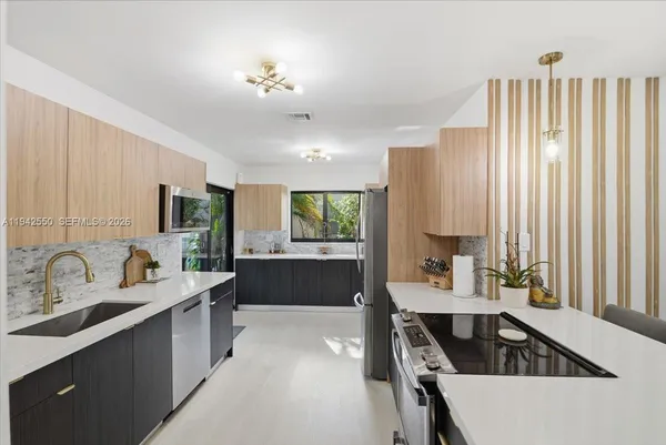 a kitchen with a sink and cabinets