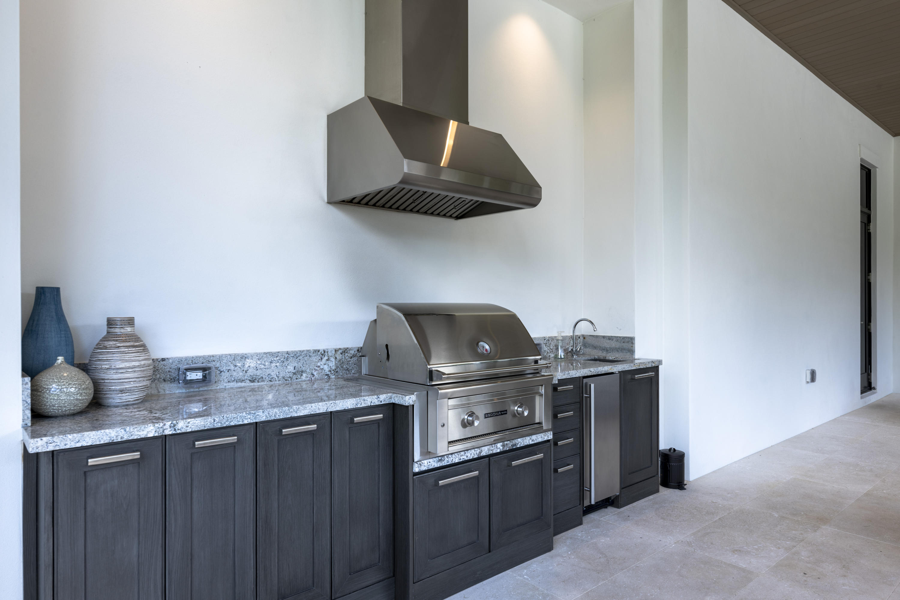 111 Clipper Lane Jupiter, FL 33477 - Photo 50 of 59 a kitchen with granite countertop a stove and a sink