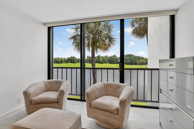a bathroom with a double vanity sink toilet mirror and bathtub