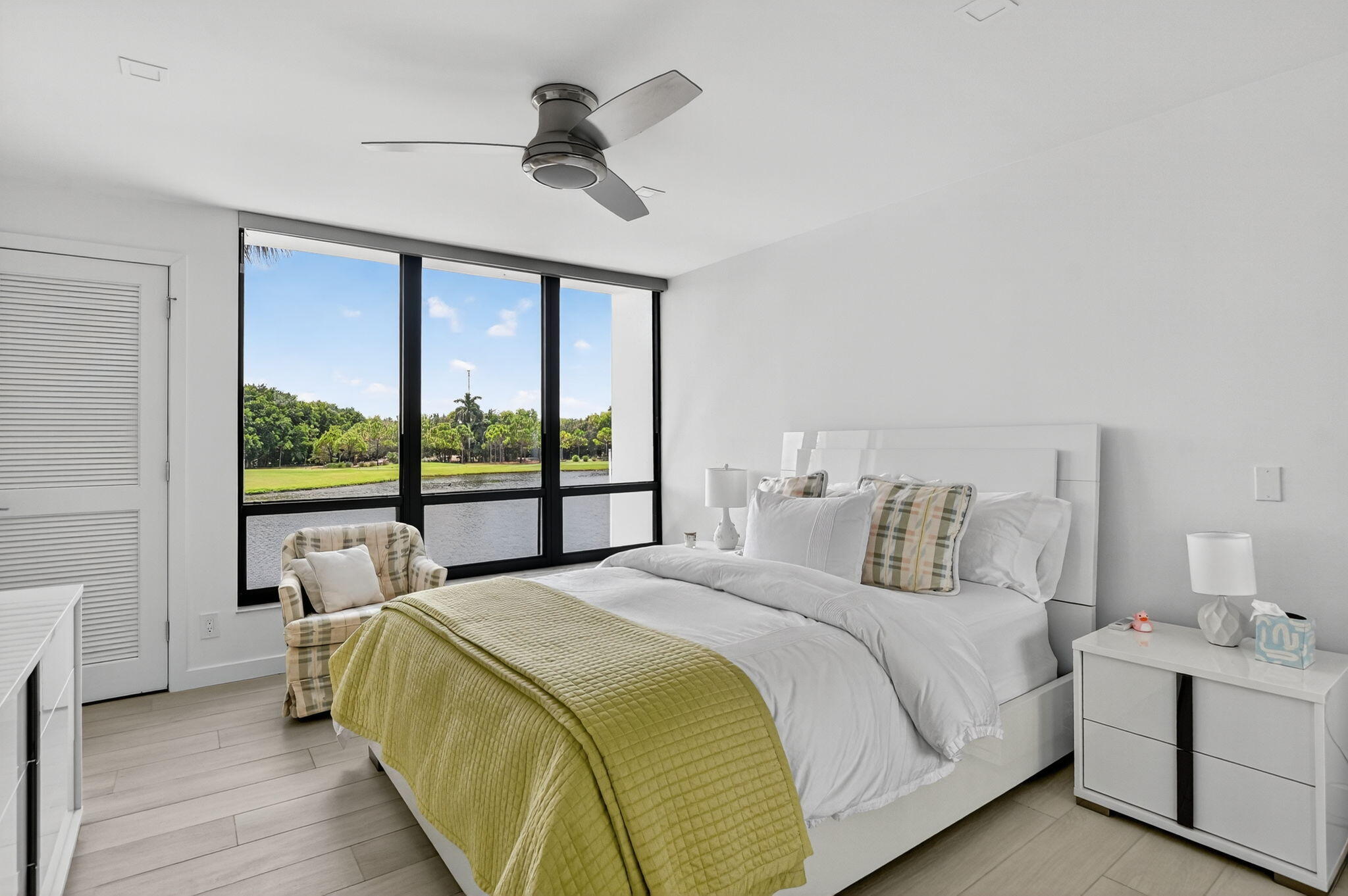 7768 Lakeside Boulevard, Unit 526 Boca Raton, FL 33434 - Photo 24 of 56 a bedroom with a large bed and a large window