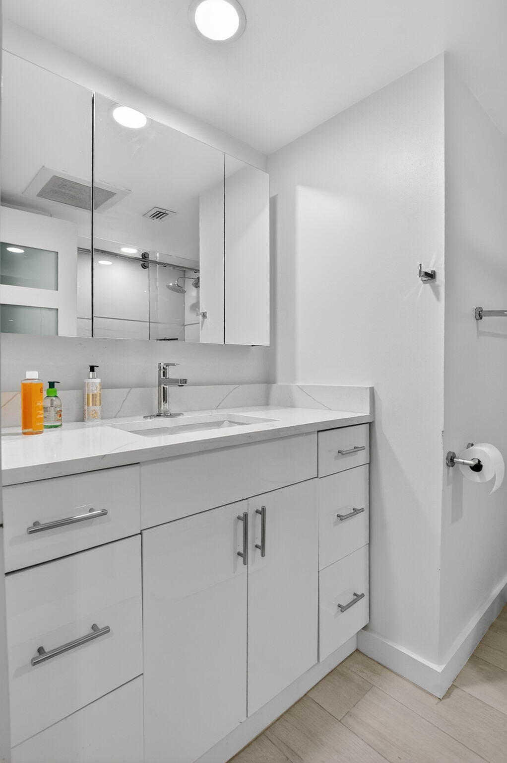 7768 Lakeside Boulevard, Unit 526 Boca Raton, FL 33434 - Photo 27 of 56 a bathroom with a sink and a mirror