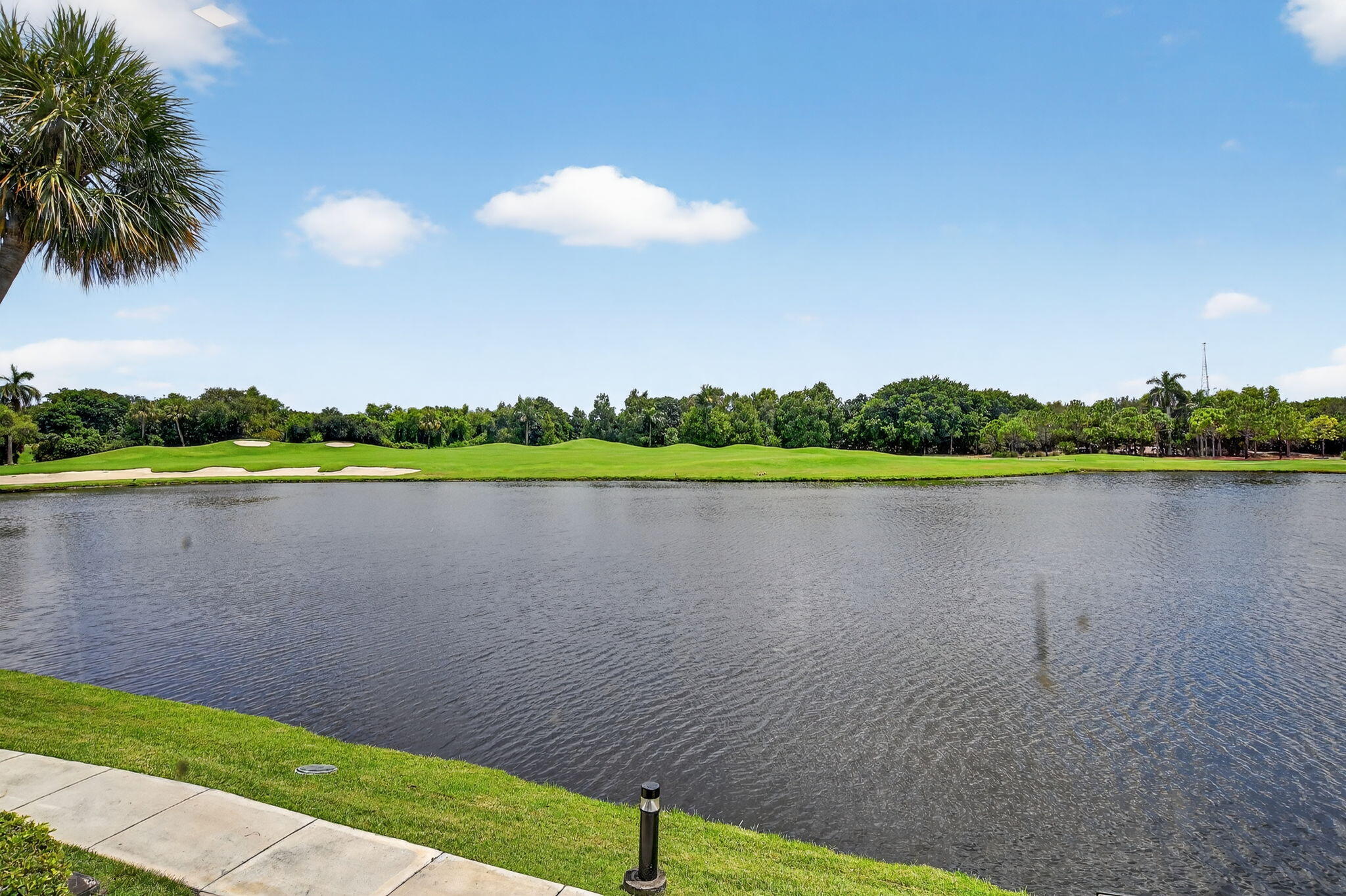 7768 Lakeside Boulevard, Unit 526 Boca Raton, FL 33434 - Photo 29 of 56 a view of a lake with a big yard
