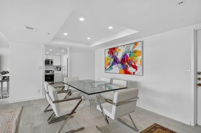 a kitchen with a sink stainless steel appliances and cabinets