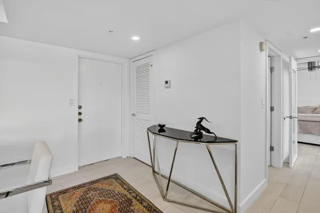 a view of a room with furniture and table