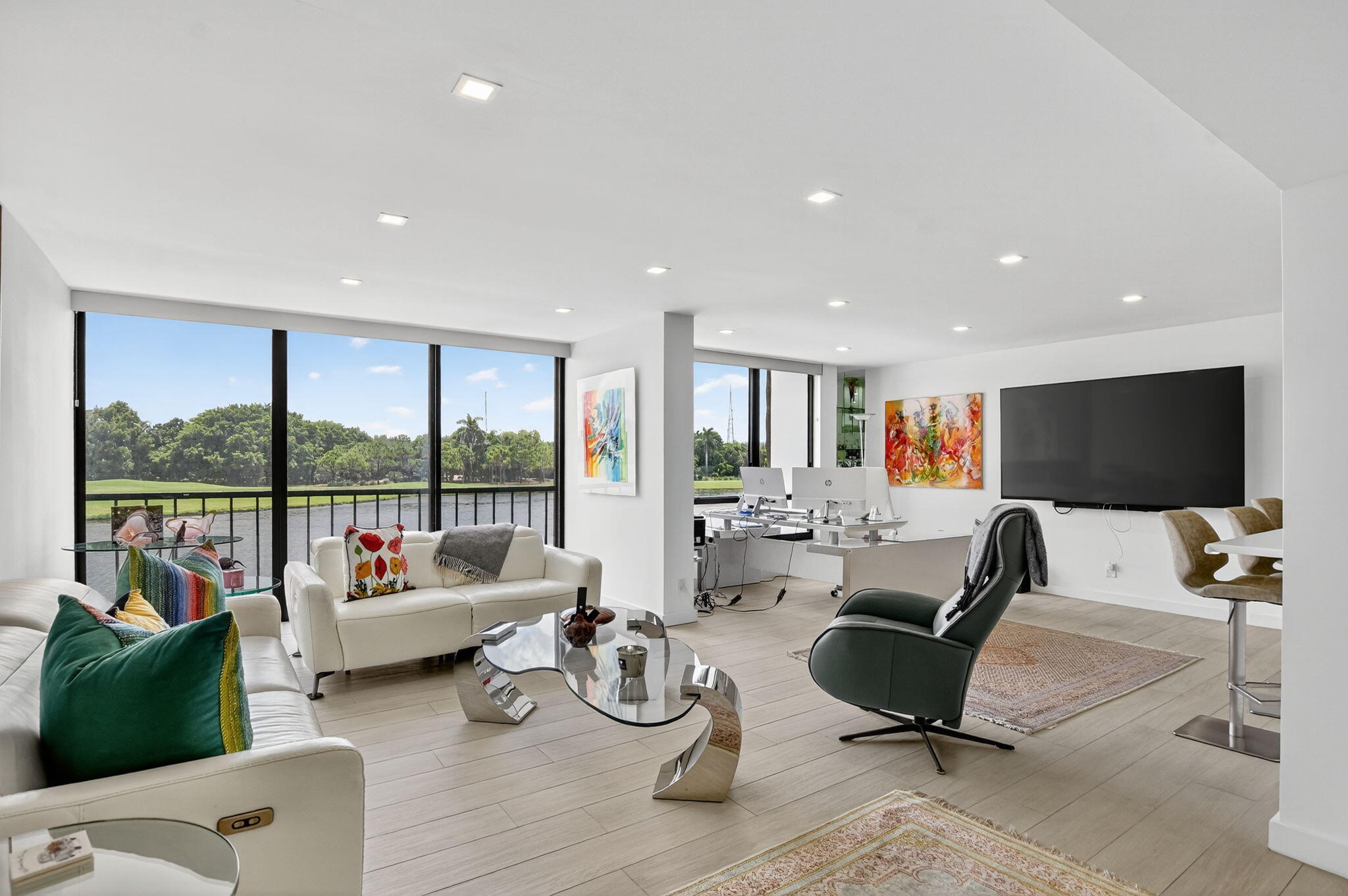 7768 Lakeside Boulevard, Unit 526 Boca Raton, FL 33434 - Photo 8 of 56 a living room with furniture and a flat screen tv
