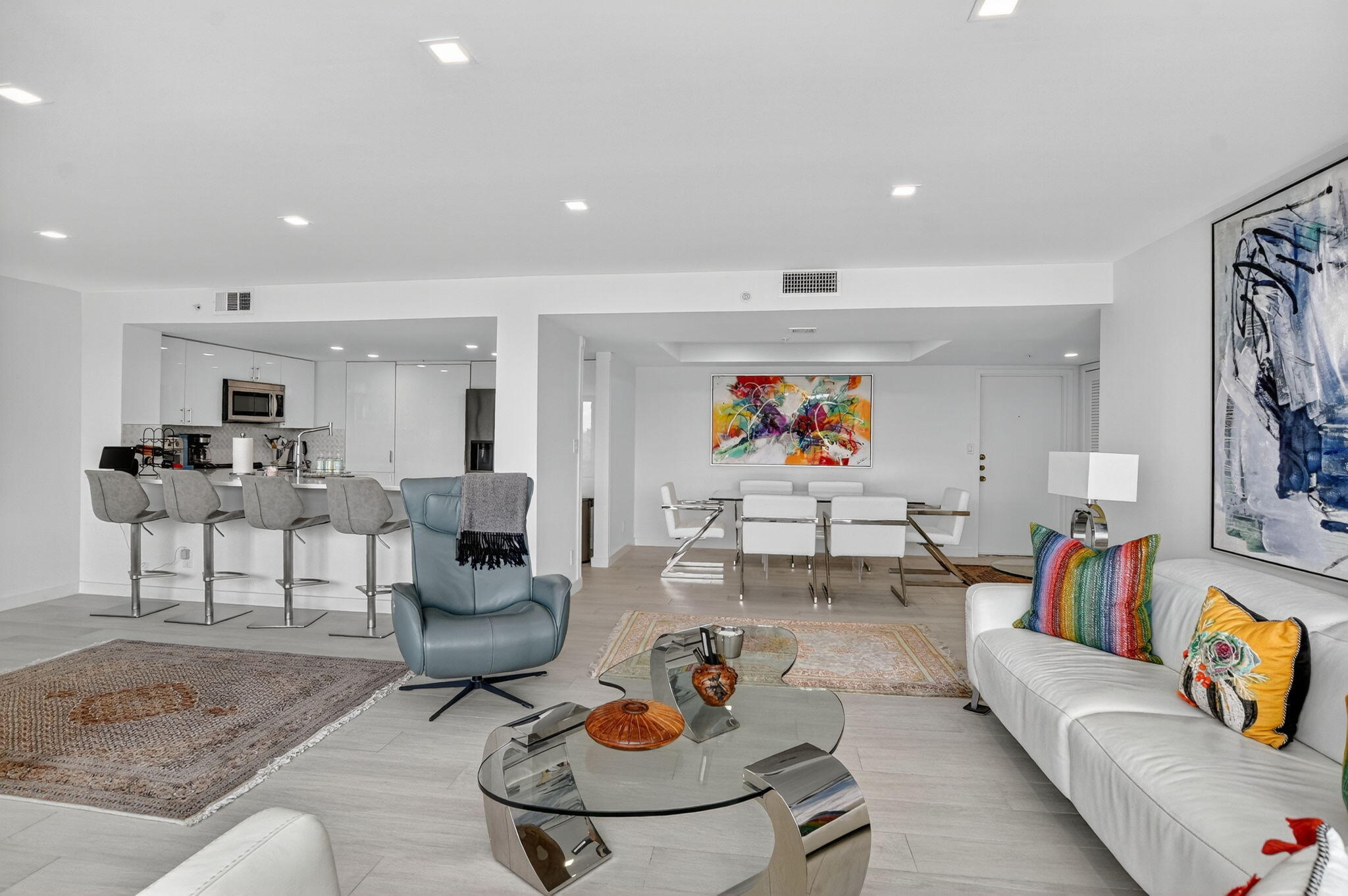 7768 Lakeside Boulevard, Unit 526 Boca Raton, FL 33434 - Photo 10 of 56 a living room with furniture kitchen view and a table