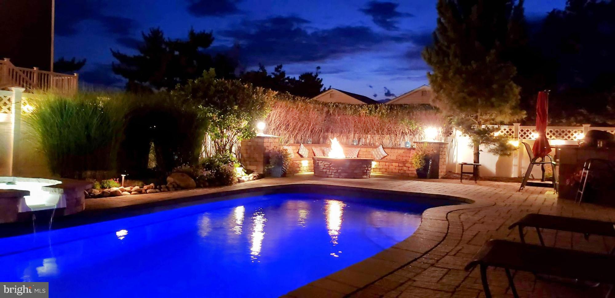 108 West 10th Street Ship Bottom, NJ 08008 - Photo 2 of 65 Pool, Hot Tub and Fire Pit in the evening
