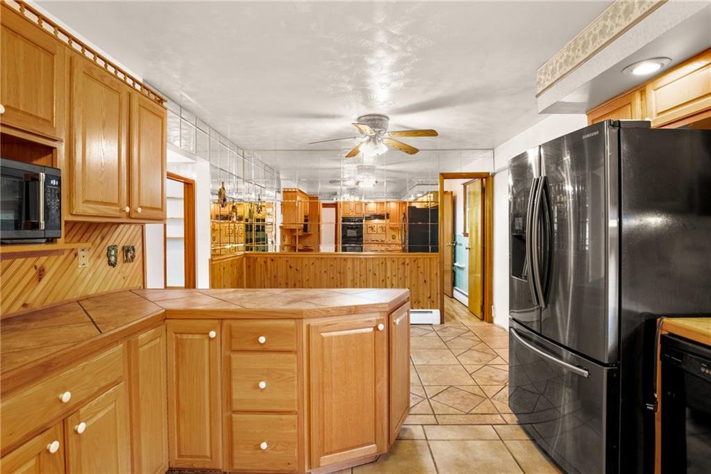 678 West Main Street Somerset, PA 15501 - Photo 14 of 38 a kitchen with stainless steel appliances granite countertop a refrigerator and a sink