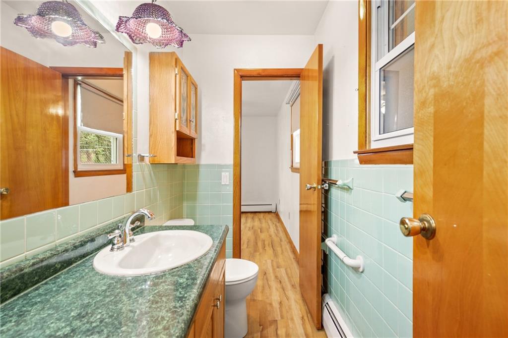 678 West Main Street Somerset, PA 15501 - Photo 16 of 38 a bathroom with a granite countertop sink and a mirror