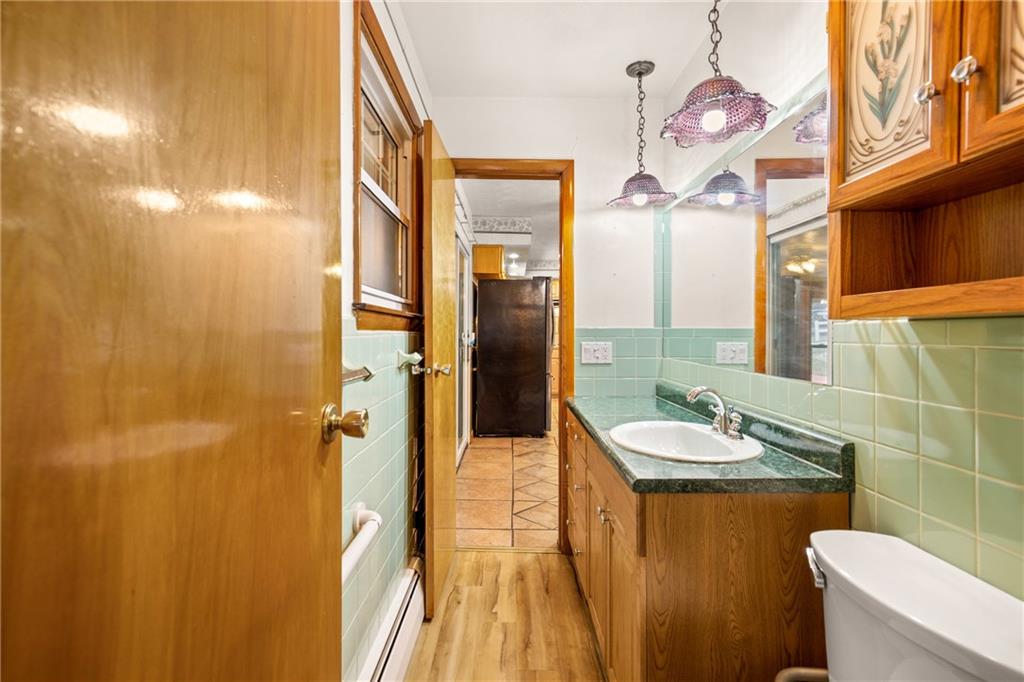 678 West Main Street Somerset, PA 15501 - Photo 17 of 38 a bathroom with a sink a toilet and shower