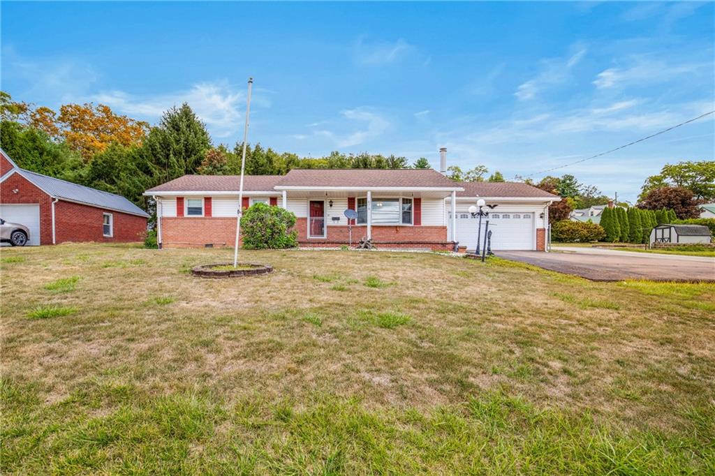 678 West Main Street Somerset, PA 15501 - Photo 2 of 38 a view of a white house with a big yard and large trees