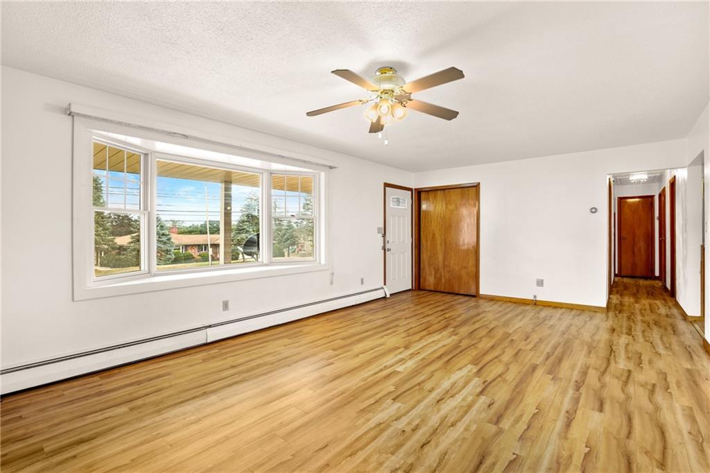 678 West Main Street Somerset, PA 15501 - Photo 6 of 38 a view of an empty room with wooden floor and a window