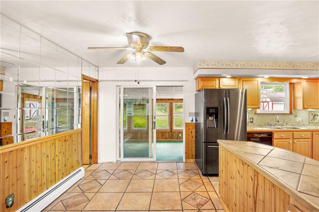 678 West Main Street Somerset, PA 15501 - Photo 7 of 38 a kitchen with stainless steel appliances granite countertop a refrigerator and a stove top oven
