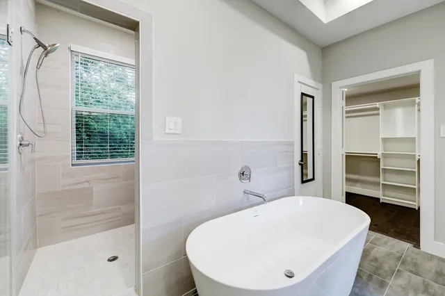 a bathroom with a sink and mirror with toilet