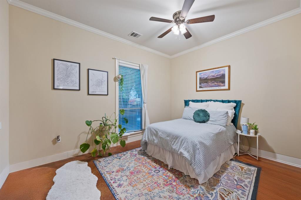 4420 Red River Street, Unit B Austin, TX 78751 - Photo 7 of 11 Well-appointed bedroom showcases beautiful hardwood flooring and elegant crown molding throughout.