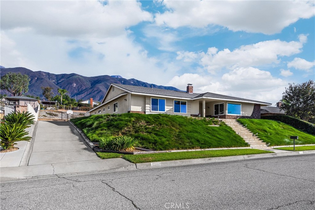 a front view of house with yard and green space