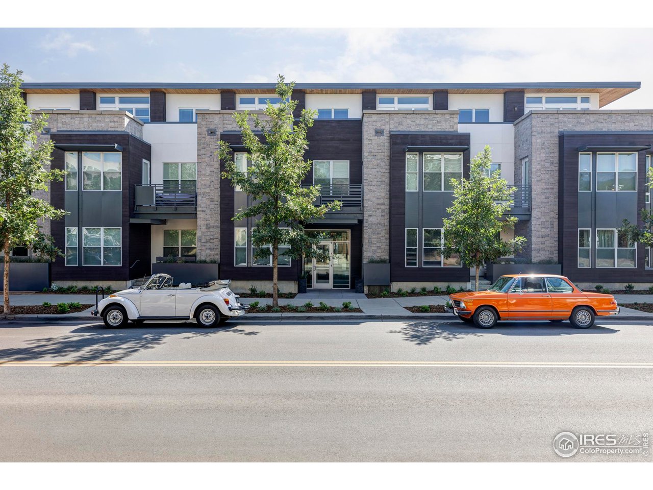 1707 Walnut Street, Unit 207 Boulder, CO 80302 - Photo 12 of 23 a car parked in front of a building