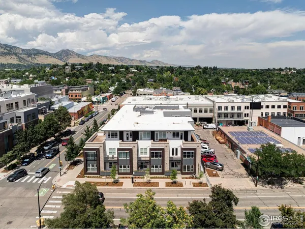 an aerial view of residential building with city view