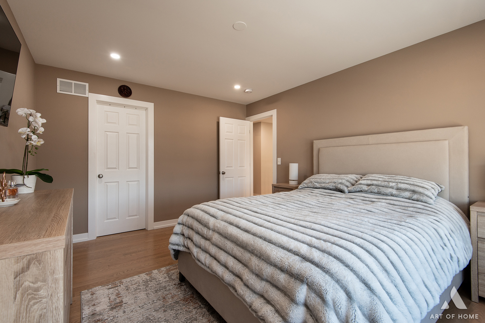 1007 Biltmore Drive Elgin, IL 60120 - Photo 20 of 43 a bedroom with a large bed and a chandelier