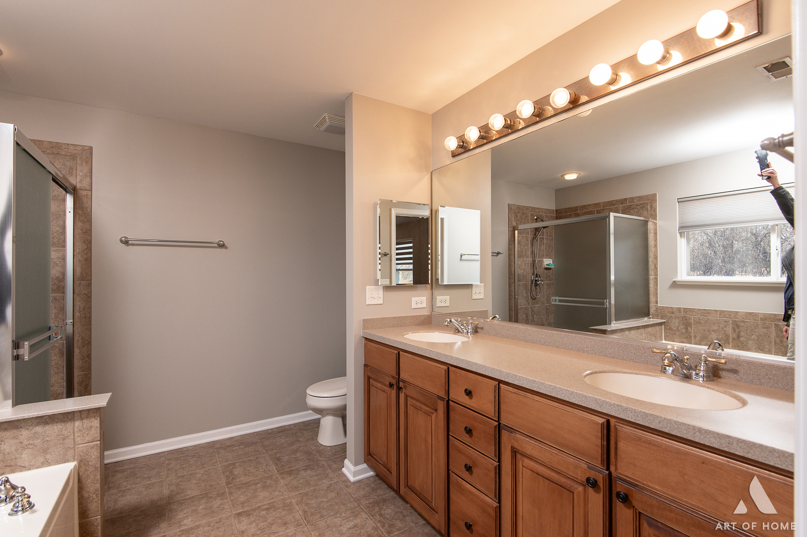 1007 Biltmore Drive Elgin, IL 60120 - Photo 23 of 43 a spacious bathroom with a double vanity sink a toilet and a mirror