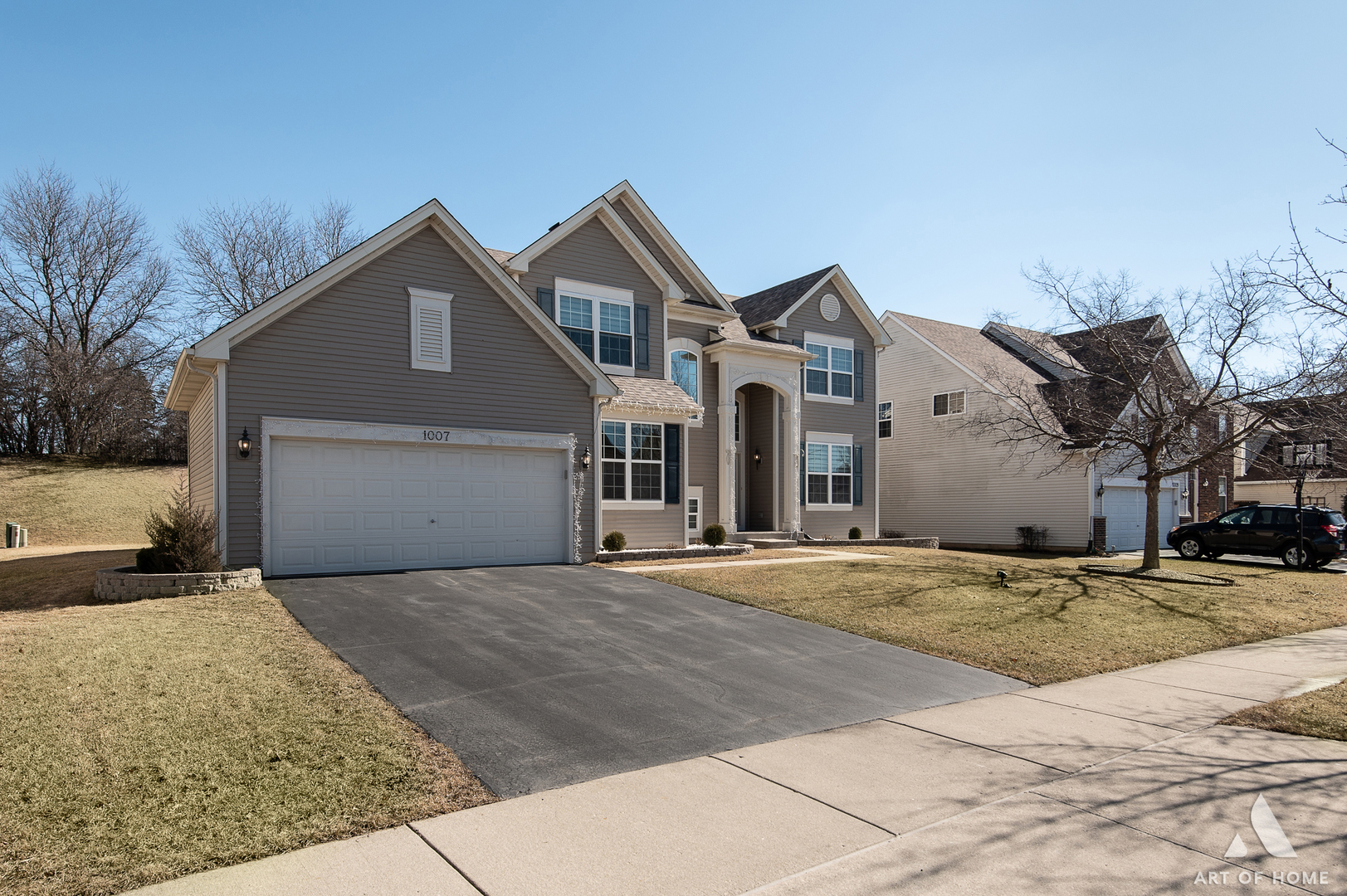 1007 Biltmore Drive Elgin, IL 60120 - Photo 38 of 43 a front view of a house with a yard and garage