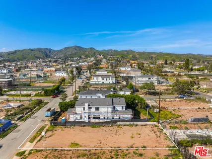 a view of a city with an ocean