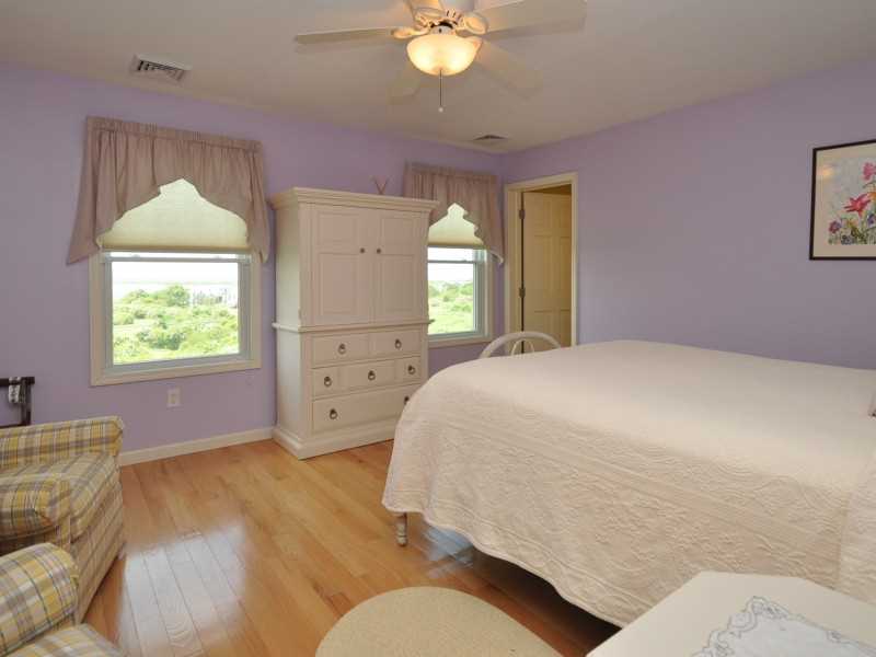 632 Corn Neck Road Block Island, RI 02807 - Photo 12 of 21 Exterior Front. Second floor bedroom with queen size bed, sitting area and bath.