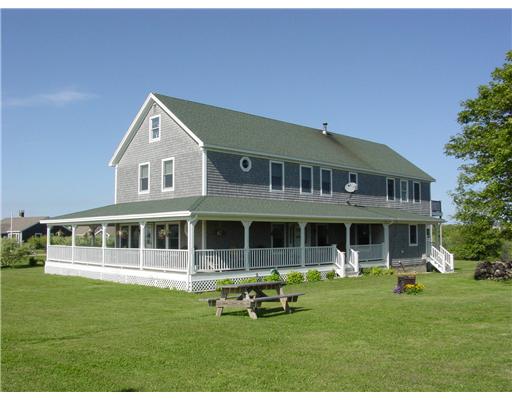 632 Corn Neck Road Block Island, RI 02807 - Photo 14 of 21 Exterior Front. 10 foot wide porches wrap around 3 sides of the building offering views and outdoor enjoyment.