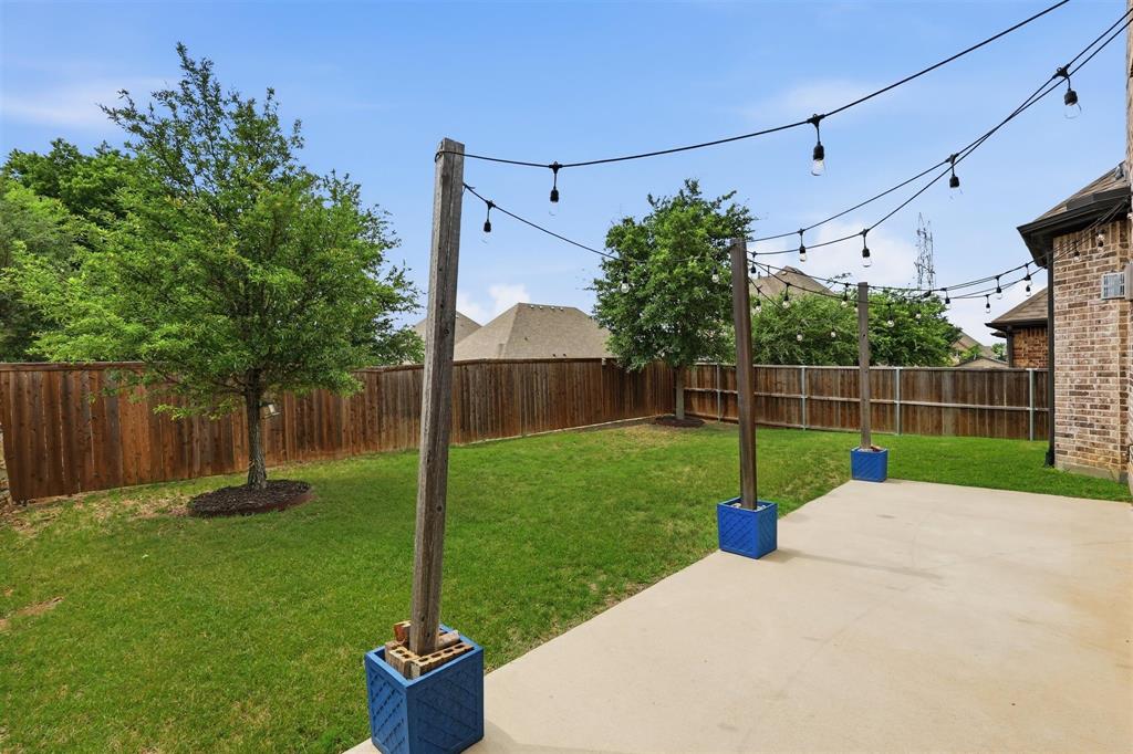 6212 Leatherstem Road Flower Mound, TX 76226 - Photo 26 of 40 Enjoy the Texas outdoors with mature landscaping and patio living.