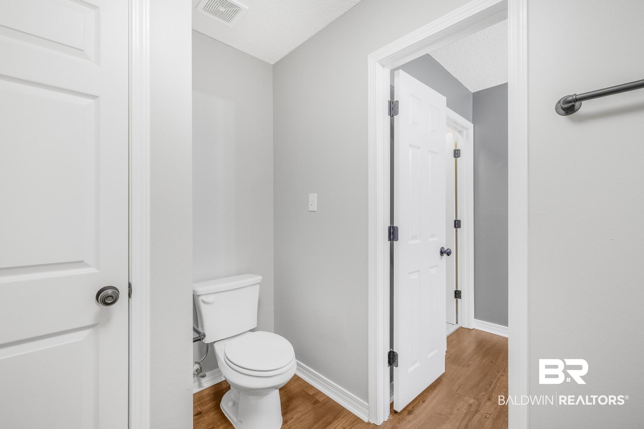 140 Hope Drive Daphne, AL 36526 - Photo 25 of 54 Bathroom with wood finished floors and a textured ceiling