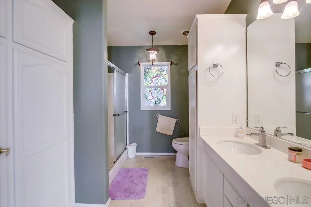 8301 Mission Gorge Road, Unit 248 Santee, CA 92071 - Photo 12 of 24 a bathroom with a sink a toilet and shower