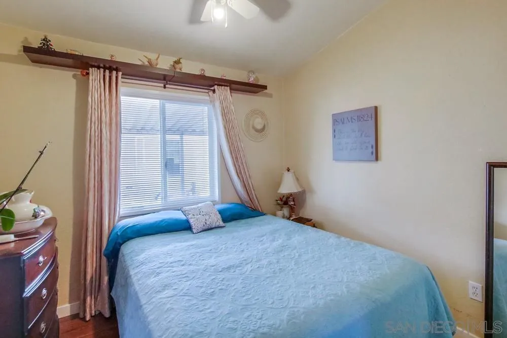 8301 Mission Gorge Road, Unit 248 Santee, CA 92071 - Photo 16 of 24 a bedroom with a bed and a window