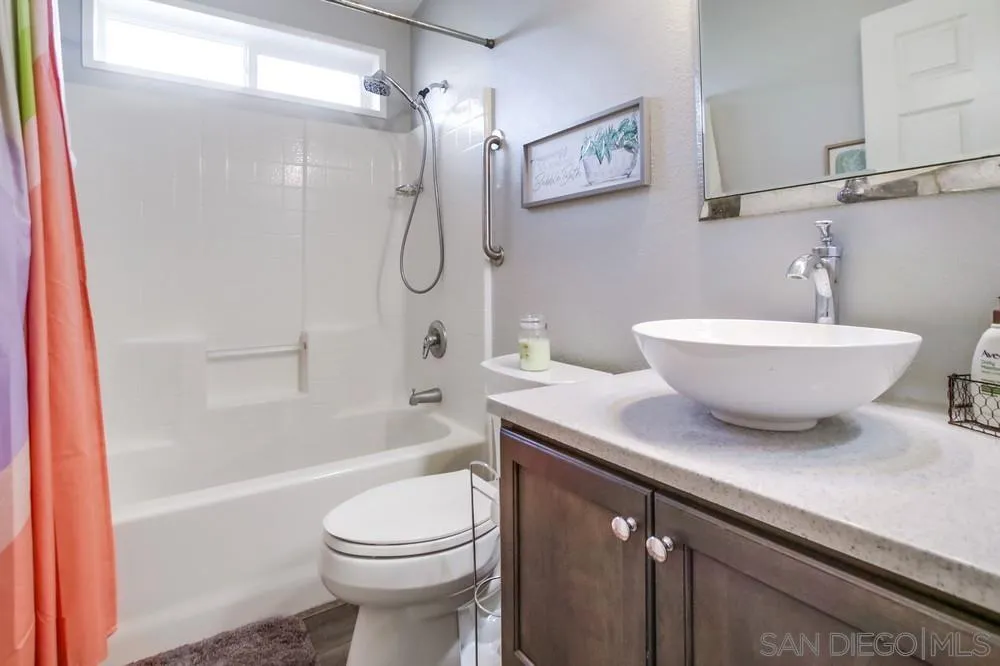 8301 Mission Gorge Road, Unit 248 Santee, CA 92071 - Photo 17 of 24 a bathroom with a sink a toilet and shower
