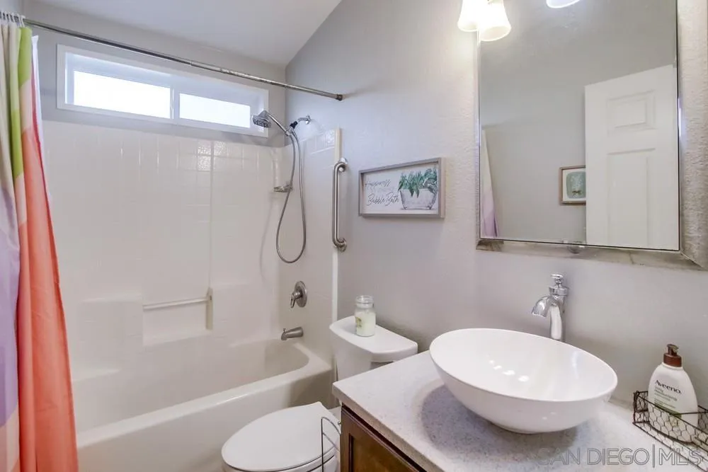 8301 Mission Gorge Road, Unit 248 Santee, CA 92071 - Photo 18 of 24 a bathroom with a sink toilet and shower