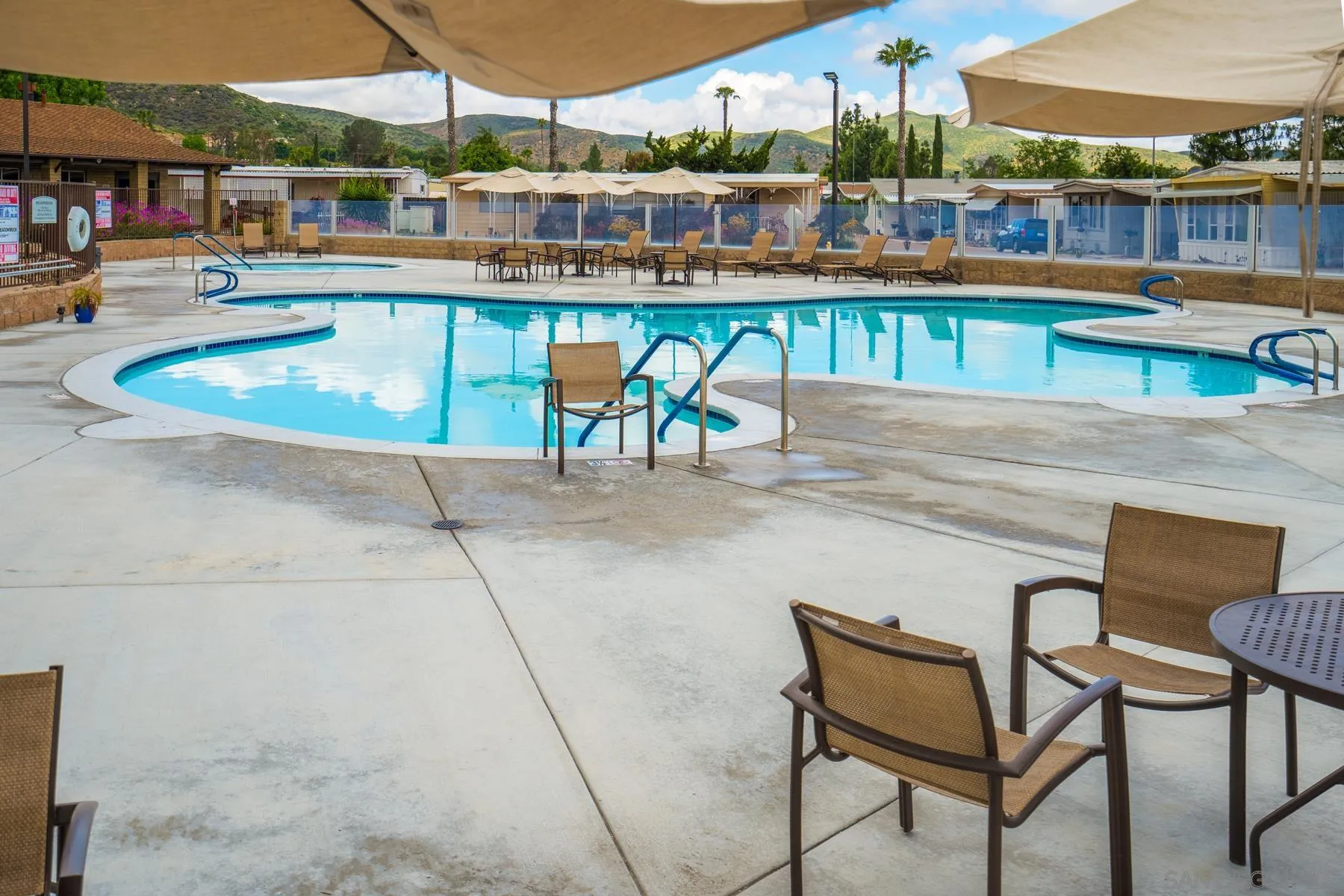 8301 Mission Gorge Road, Unit 248 Santee, CA 92071 - Photo 2 of 24 a balcony with table and chairs