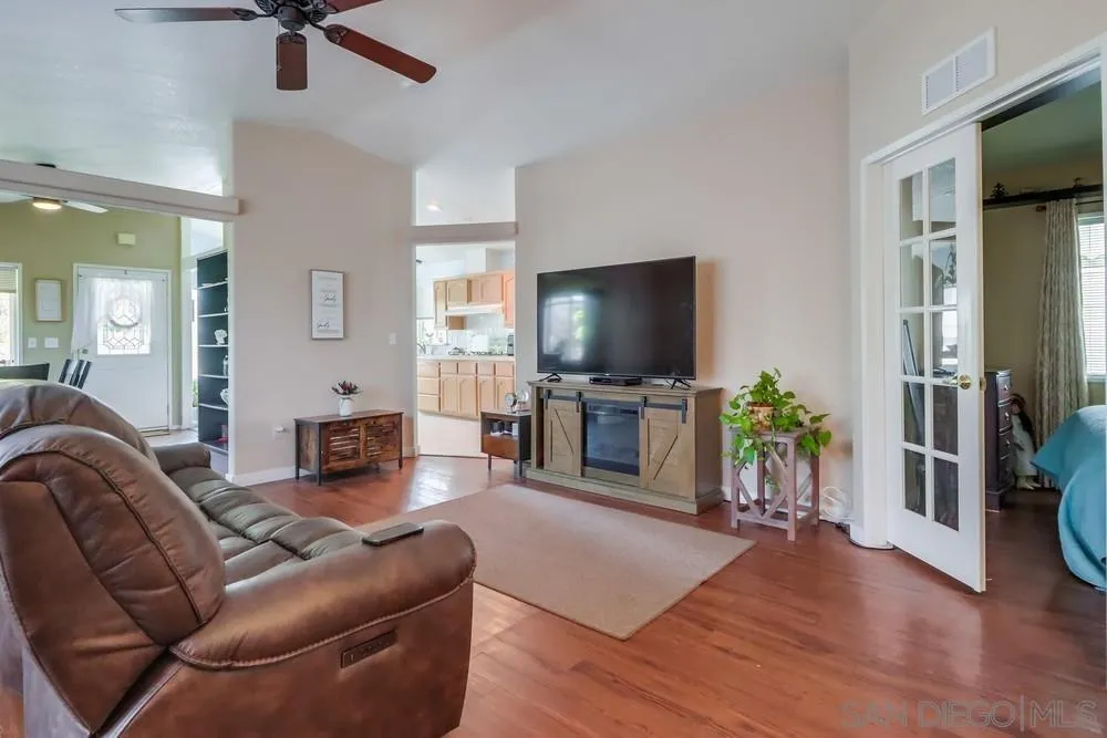 8301 Mission Gorge Road, Unit 248 Santee, CA 92071 - Photo 4 of 24 a living room with furniture and a flat screen tv