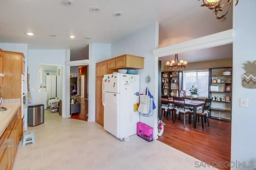 8301 Mission Gorge Road, Unit 248 Santee, CA 92071 - Photo 9 of 24 a view of a dining room with furniture and wooden floor
